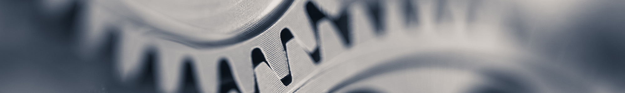 Zwei Zahnräder greifen ineinander. Ein Symbolbild für das vernetzte Denken von Dr. Werner Boysen und seinen Leistungen. 